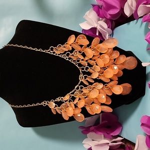 Beautiful Coral colored beads and Gold toned hardware. Stunning.